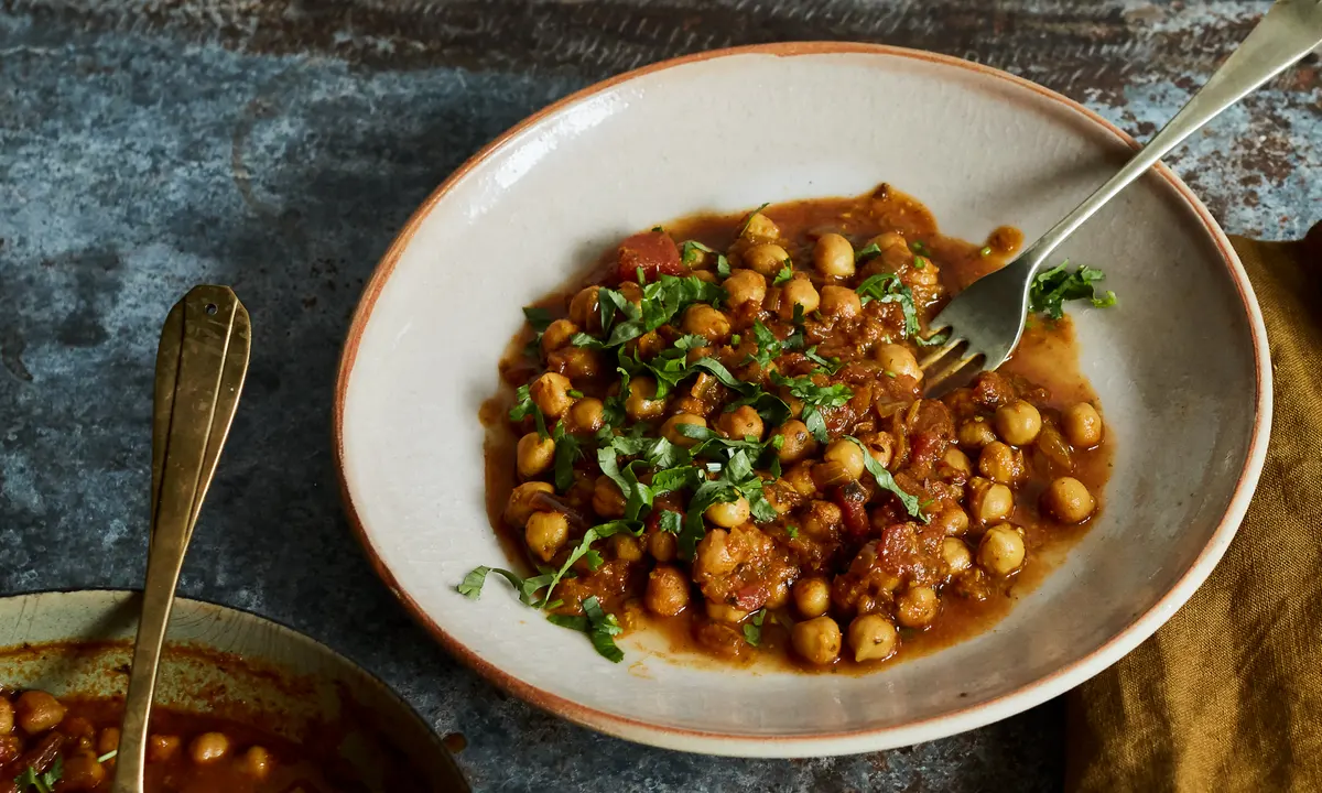 Begin your chana masala journey by sautéing onions and spices to create a fragrant foundation