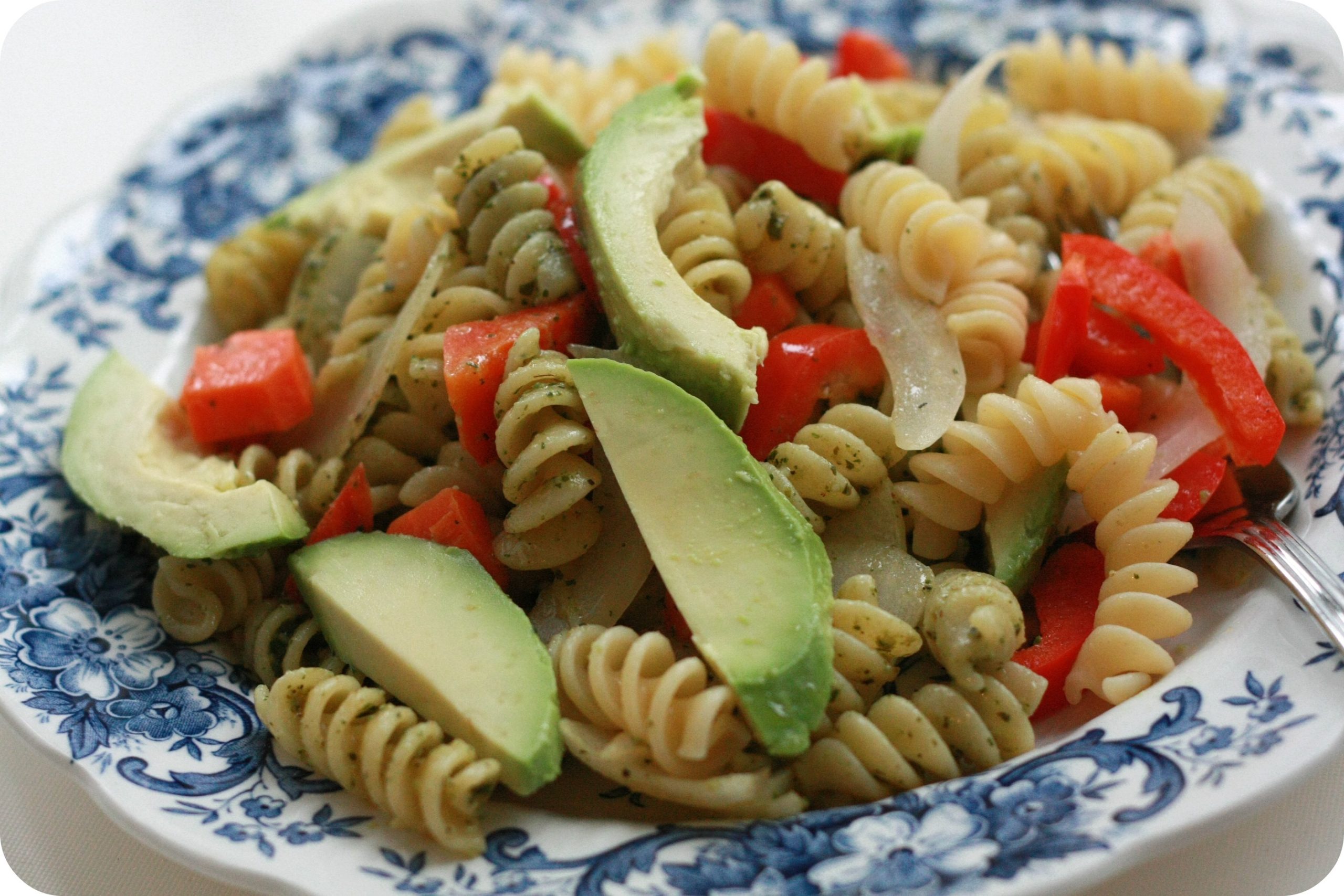 Combine all ingredients in a bowl, toss gently, add herbs and extras, and taste for seasoning