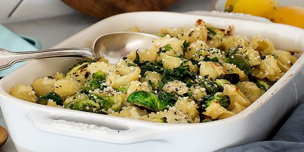 This cozy vegan pasta bake with roasted Brussels sprouts and creamy sauce is a delicious, planet-friendly comfort food you'll crave