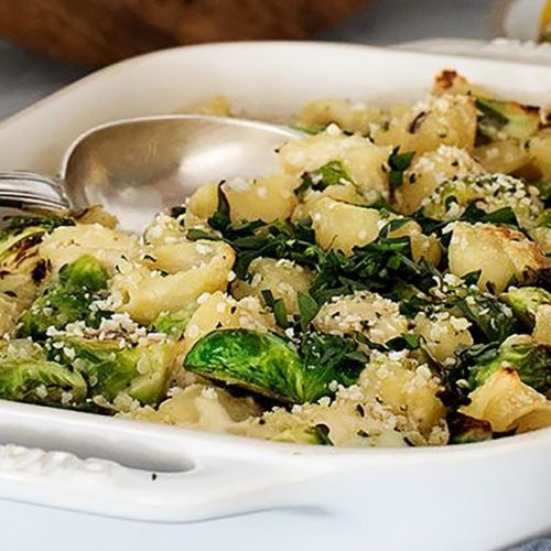 This cozy vegan pasta bake with roasted Brussels sprouts and creamy sauce is a delicious, planet-friendly comfort food you'll crave