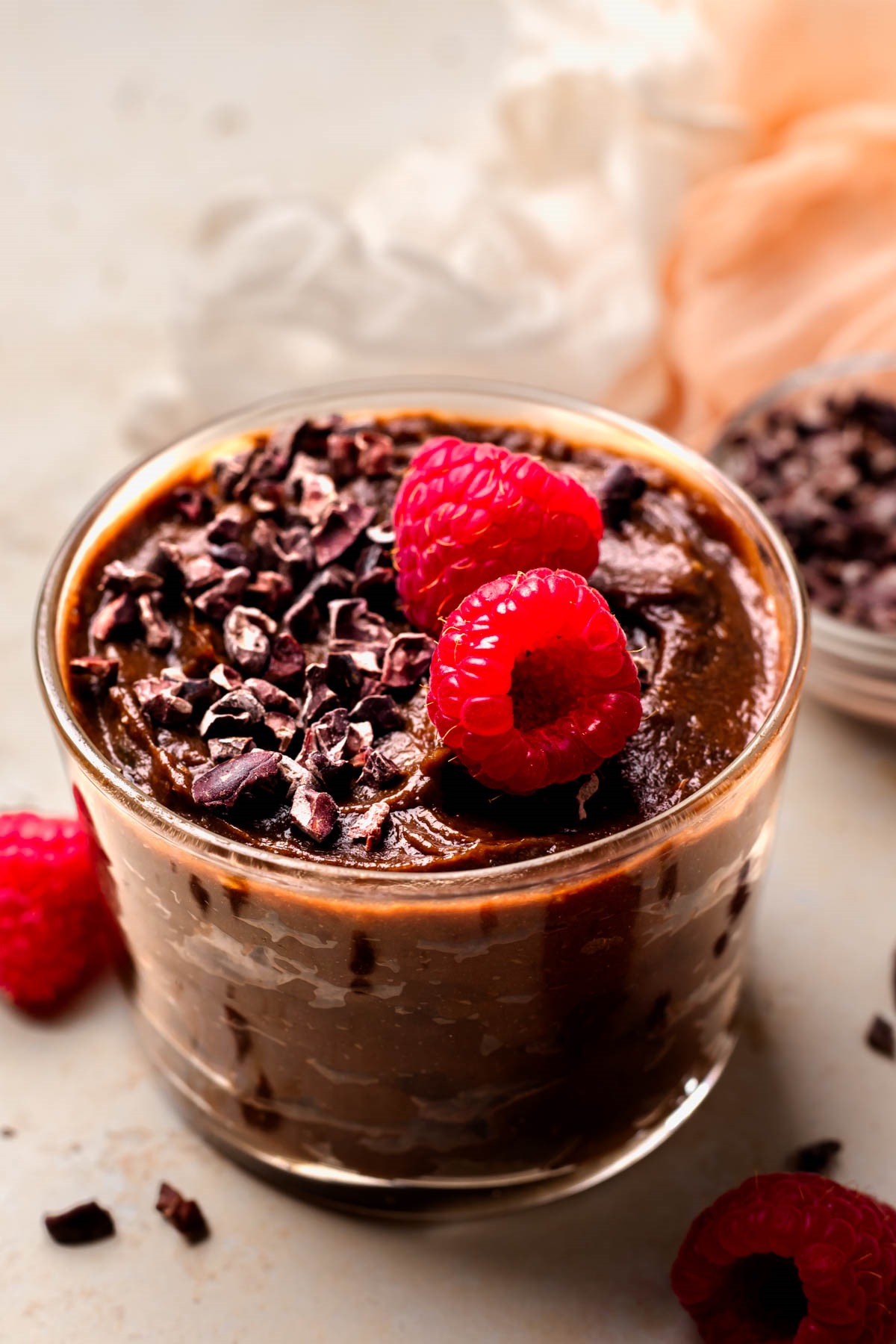 Elevate your vegan chocolate mousse with berries, nuts, chocolate shavings, or whipped coconut cream