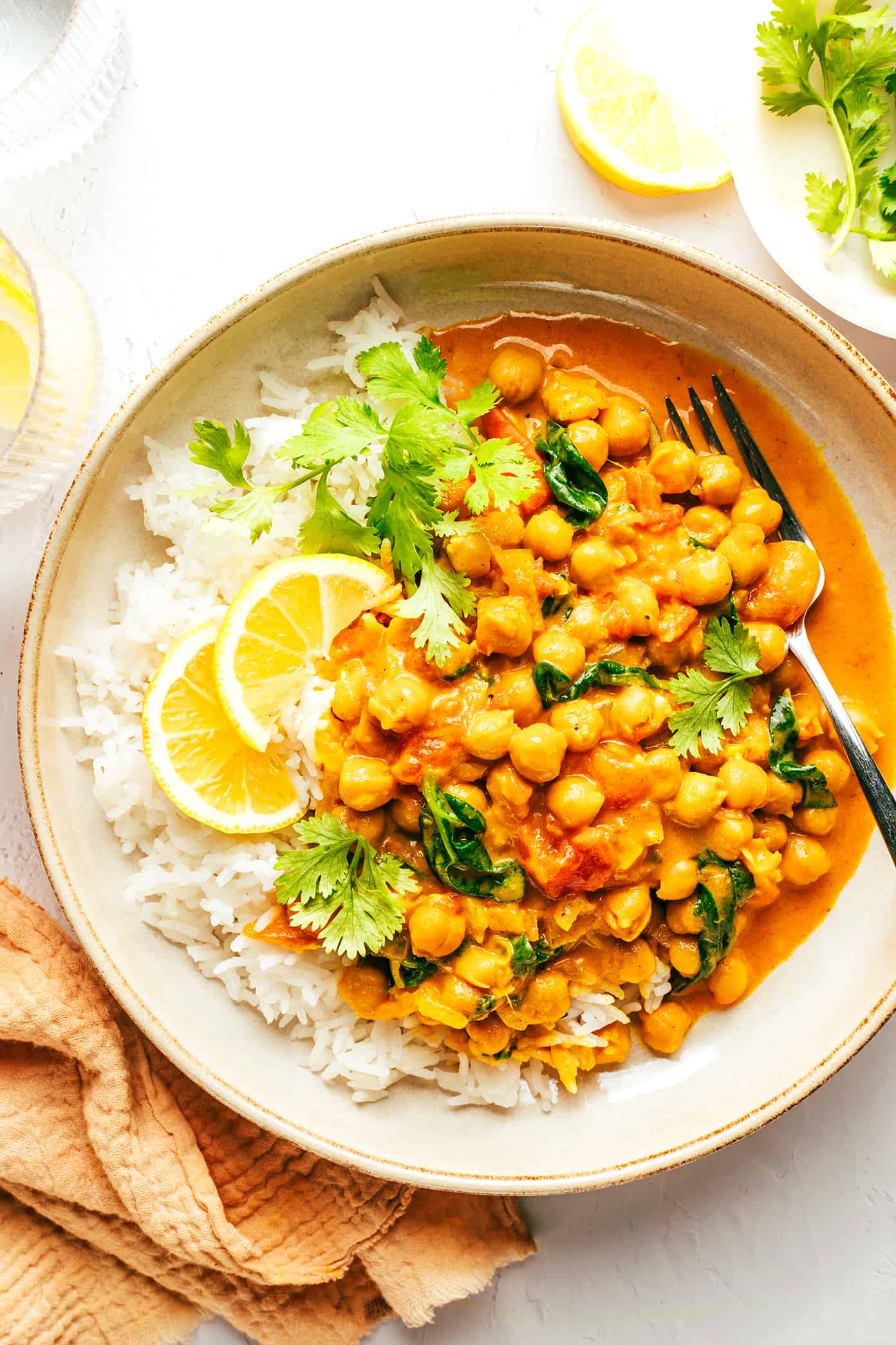 Enjoy chana masala on rice, cauliflower rice, or veggies, garnished with cilantro, and feel free to substitute ingredients as needed!