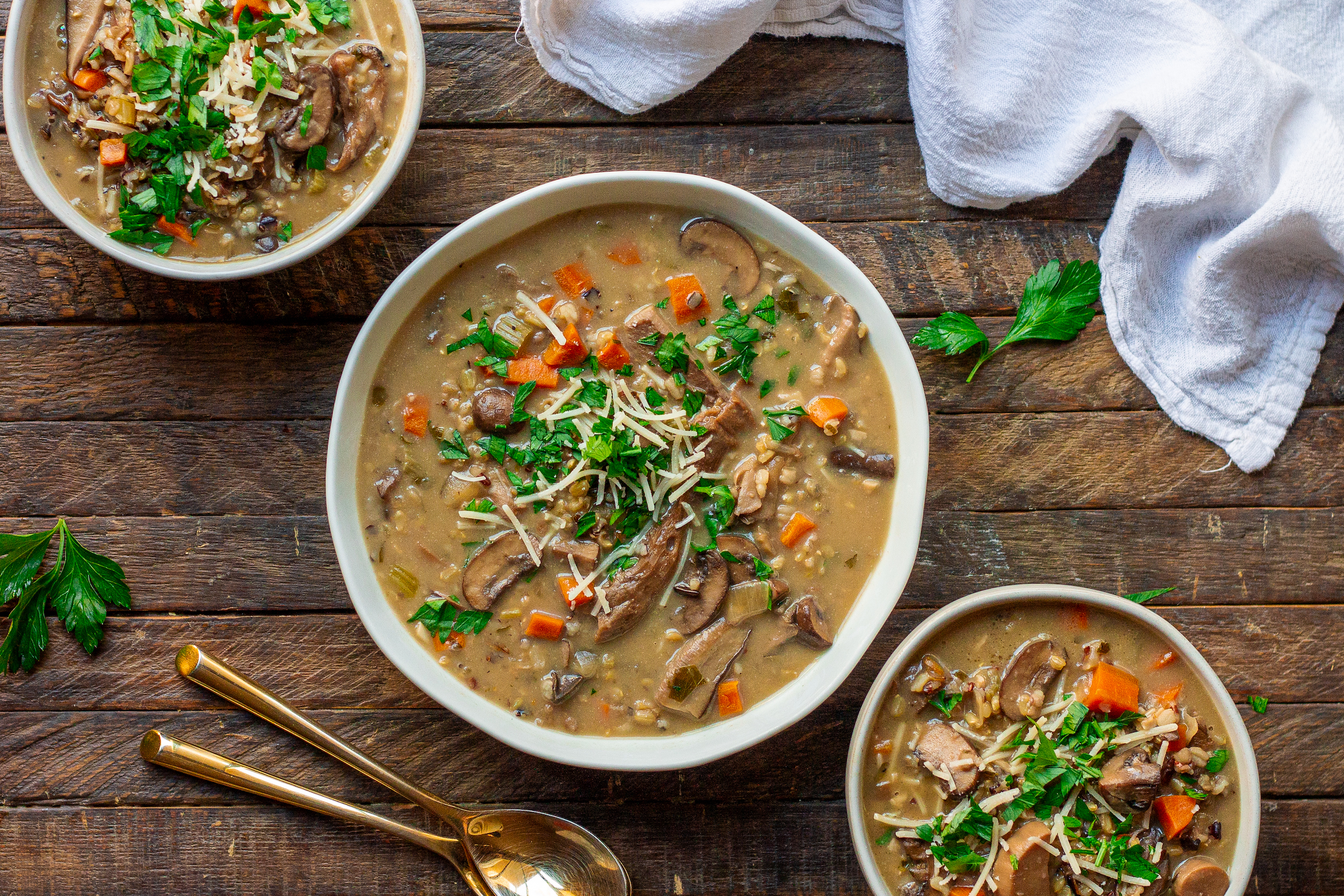 Gather butter, mushrooms, aromatics, veggies, wild rice, broth, flour, milk, seasonings, and optional additions like wine, Parmesan, and fresh herbs