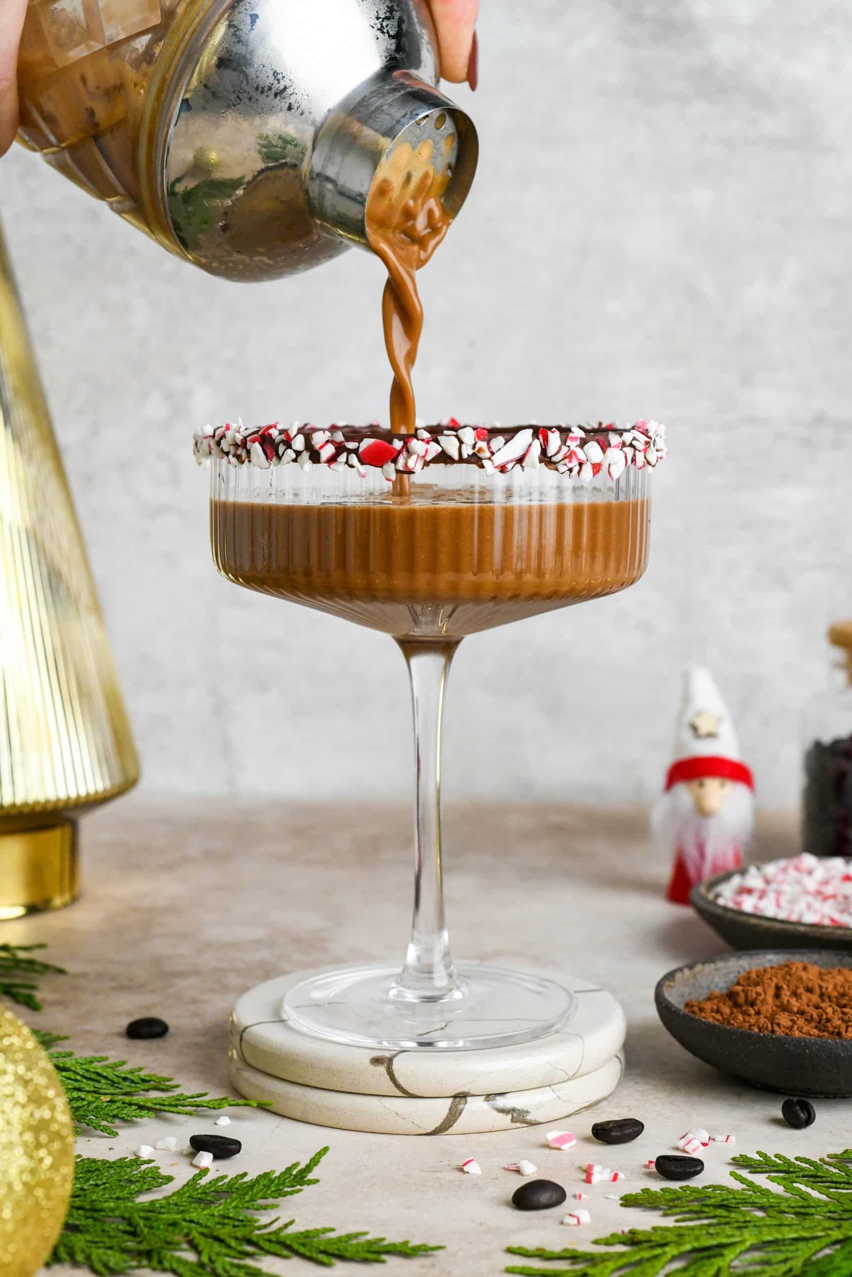 Gather your ingredients: frozen coffee, peppermint liqueur, vodka, simple syrup, and optional extras