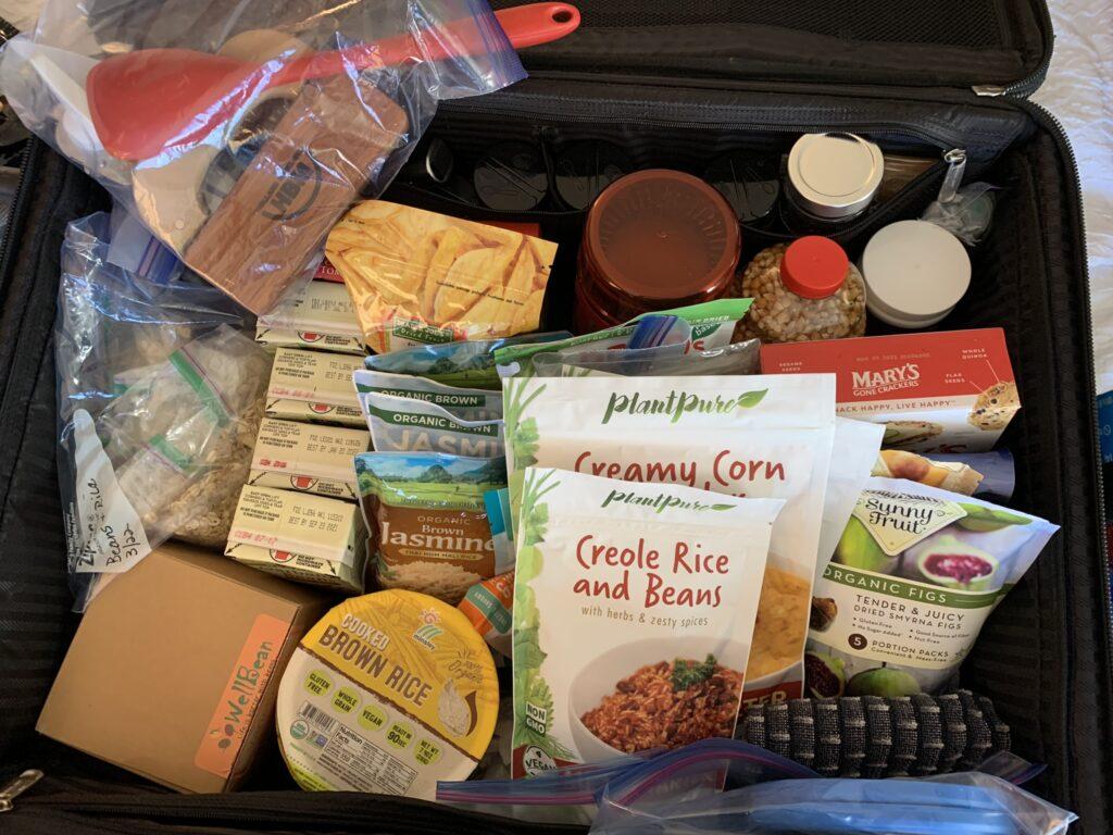 Pack light with reusable essentials, snacks, supplements, and spices for a delicious vegan journey