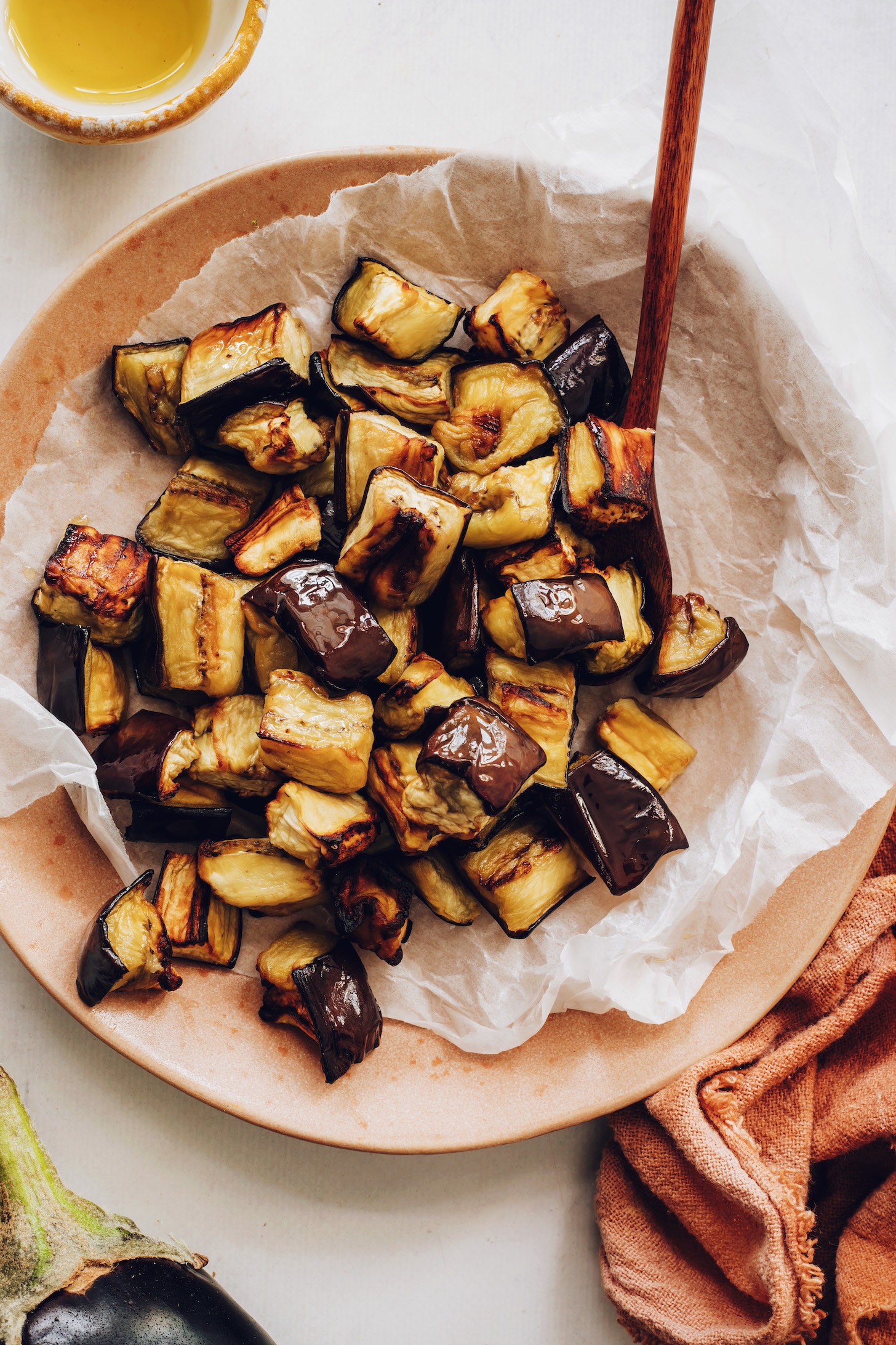 Rinse, slice, and salt your eggplant, then roast it with olive oil at 400°F until tender and golden