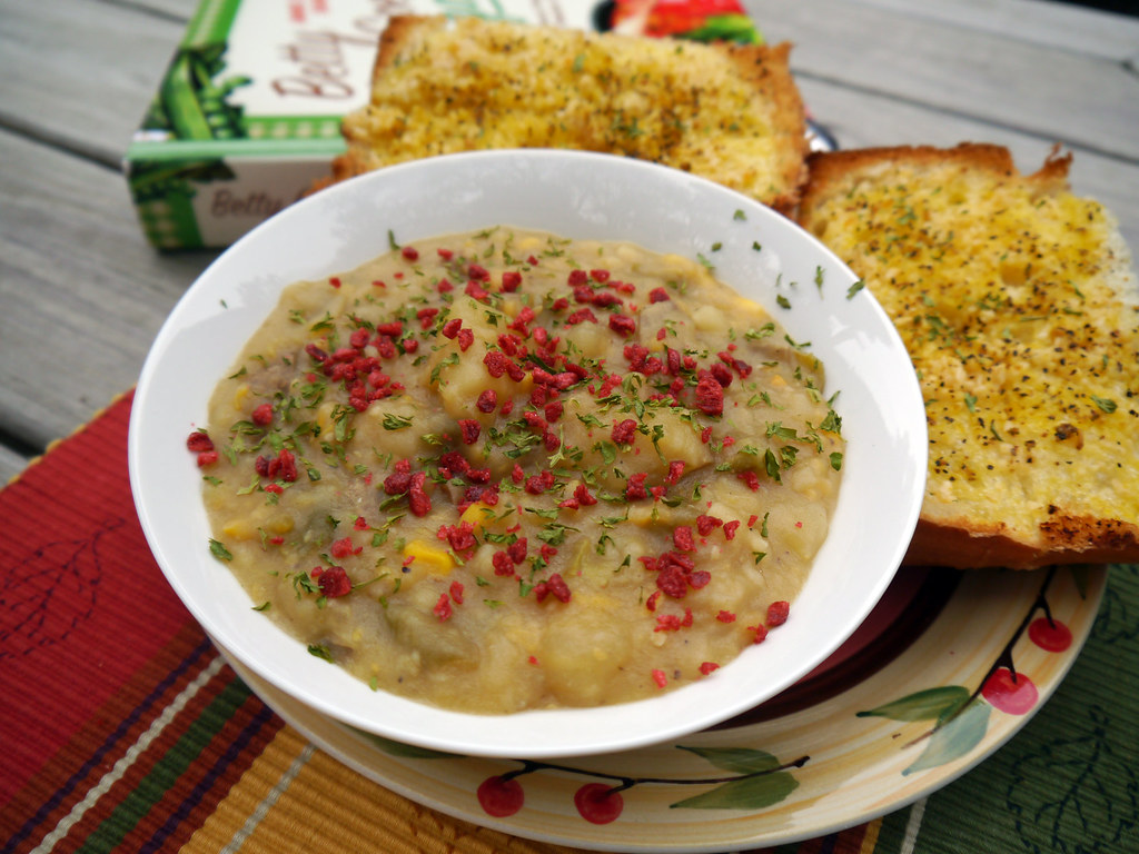 Corn, potatoes, smoky spices, aromatics, broth, coconut milk, and fresh herbs create the chowder's flavorful base